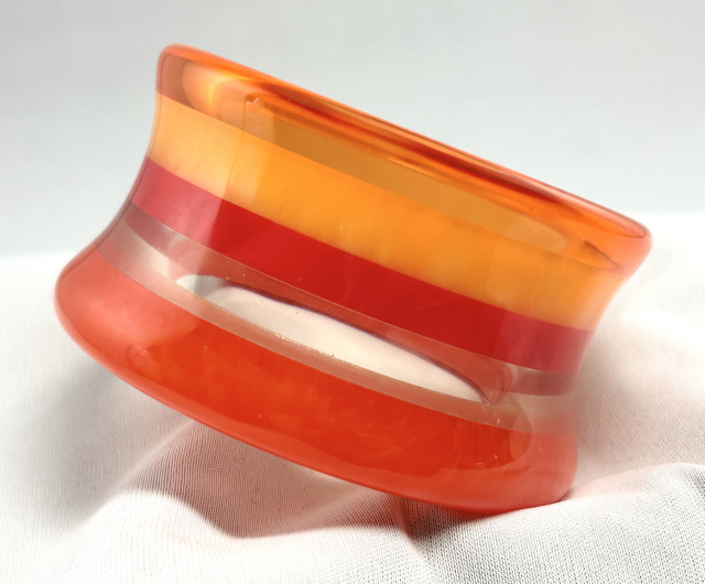 AP5 huge orange laminated concave asymmetrical bakelite bangle