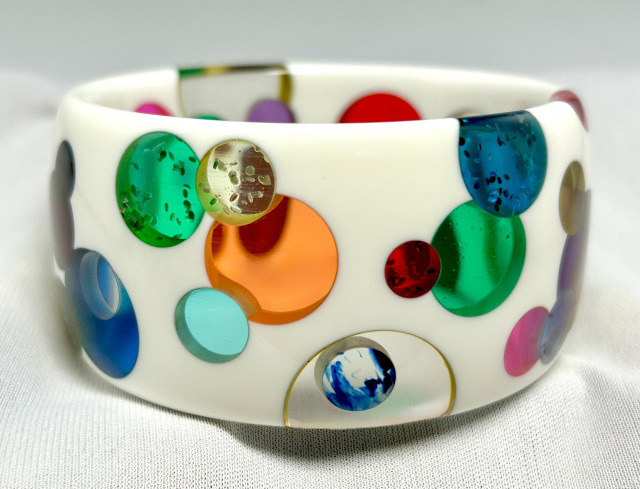 AP12 wide thru wall prystal dots on white bakelite bangle