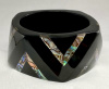 PONO121  black resin bangle with inset abalone chevrons