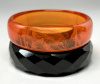 BBU6 transparent orange & faceted black bakelite bangles